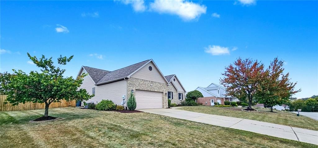 227 Meadow Spring Road Greensburg, PA 15601 - Photo 6 of 50 a front view of a house with a yard and garage