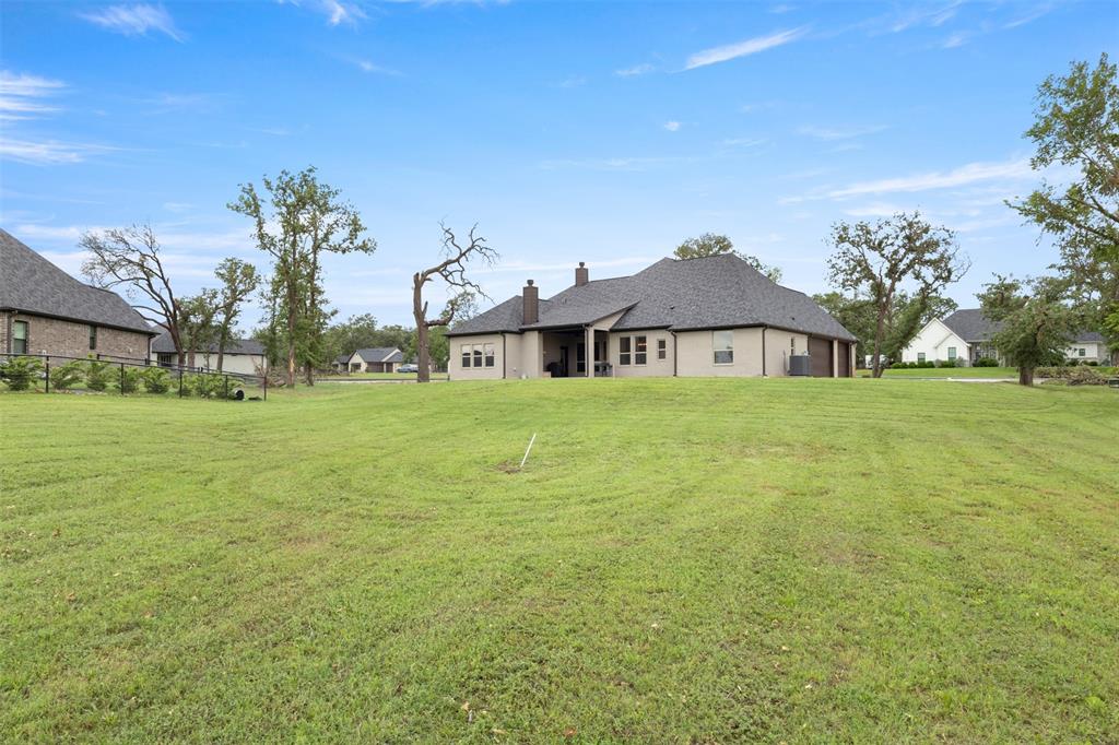 105 Clayton Crossing Springtown, TX 76082 - Photo 31 of 40 a house view with garden space