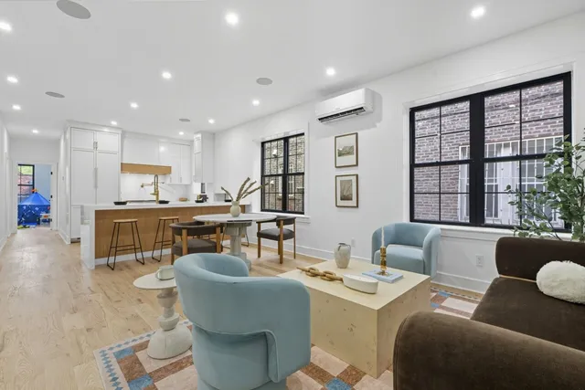 a living room with furniture and a table
