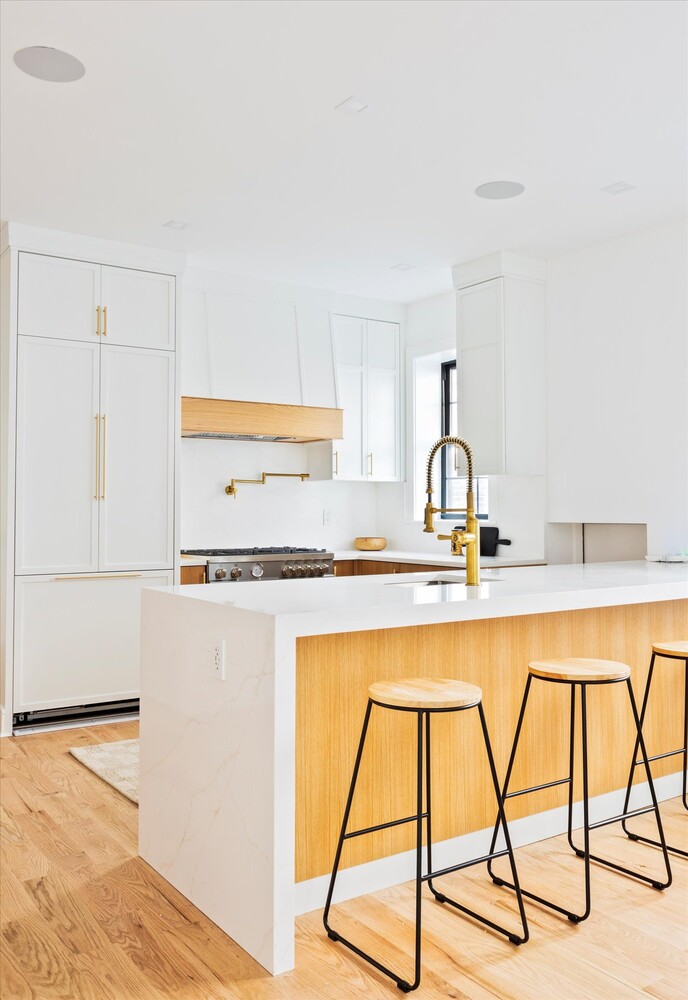 1109 Hancock Street Brooklyn, NY 11221 - Photo 12 of 30 a kitchen with a sink a stove and white cabinets with wooden floor