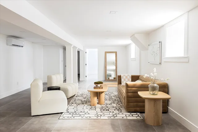 a living room with furniture and white walls