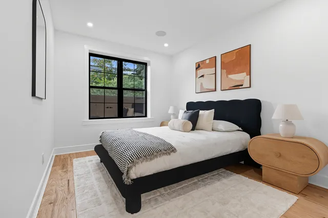 a bedroom with furniture and wooden floor