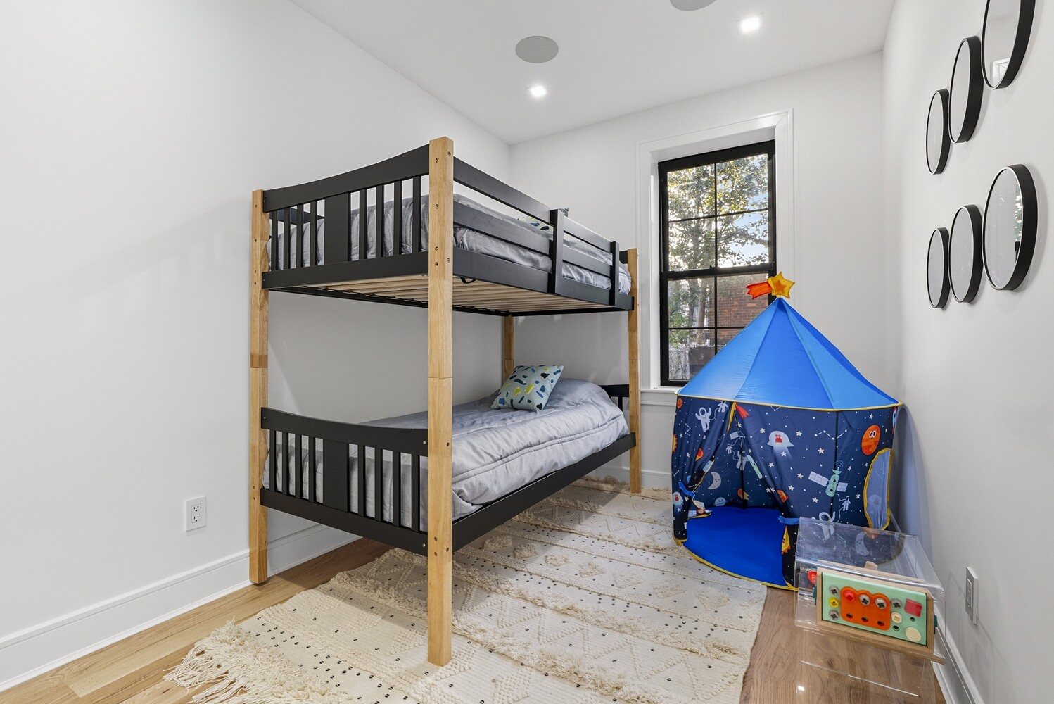 1109 Hancock Street Brooklyn, NY 11221 - Photo 24 of 30 a bedroom with furniture and wooden floor