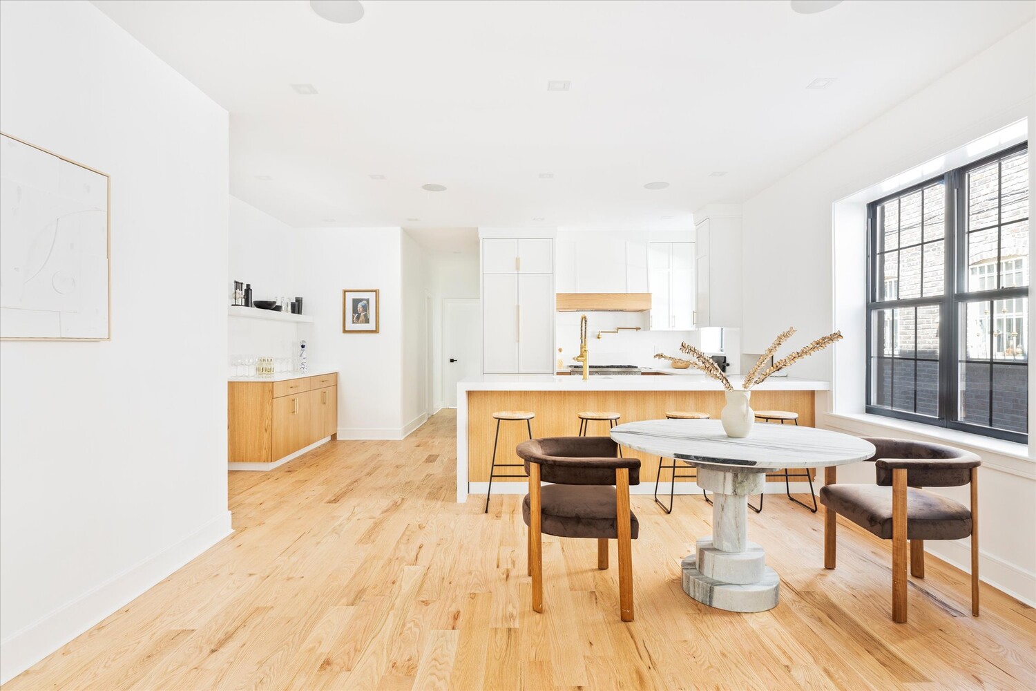 1109 Hancock Street Brooklyn, NY 11221 - Photo 9 of 30 a living room with furniture a dining table and a wooden floor