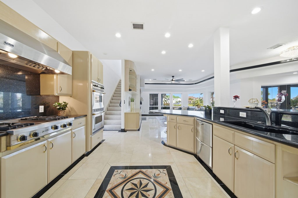 1907 Ray Shell Court Seabrook, TX 77586 - Photo 23 of 50 a kitchen with stainless steel appliances a sink stove and refrigerator