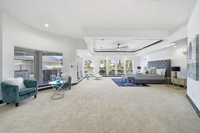 a large white kitchen with a large window