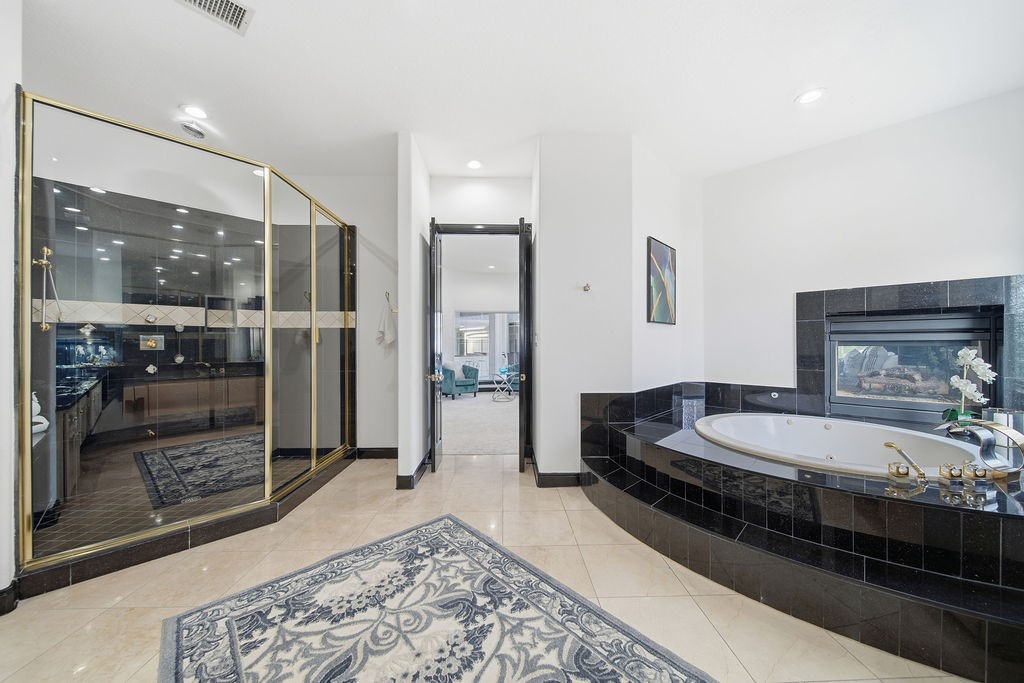 1907 Ray Shell Court Seabrook, TX 77586 - Photo 29 of 50 a spacious bathroom with a double vanity sink and a mirror