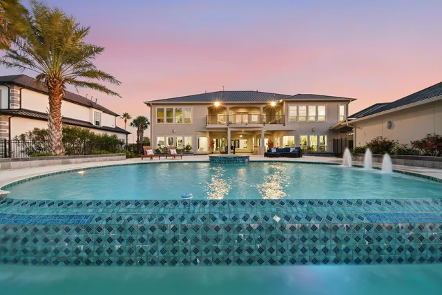 a view of building with river in front of it