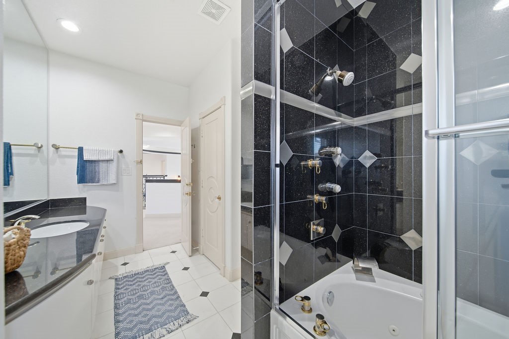 1907 Ray Shell Court Seabrook, TX 77586 - Photo 33 of 50 a bathroom with a bathtub and shower