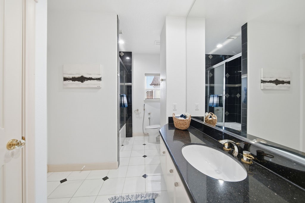 1907 Ray Shell Court Seabrook, TX 77586 - Photo 36 of 50 a bathroom with a double vanity sink and mirror