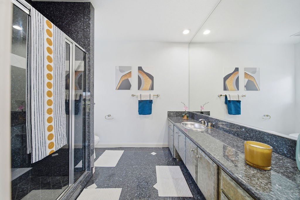 1907 Ray Shell Court Seabrook, TX 77586 - Photo 38 of 50 a bathroom with a granite countertop sink and a mirror