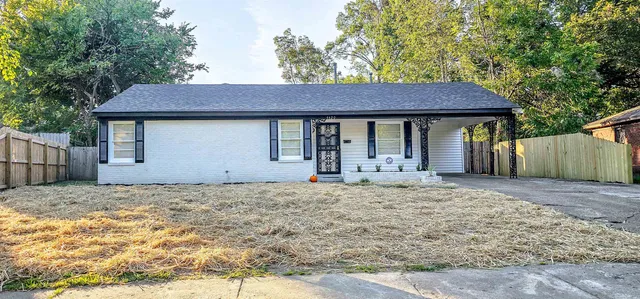 a house with yard in front of it
