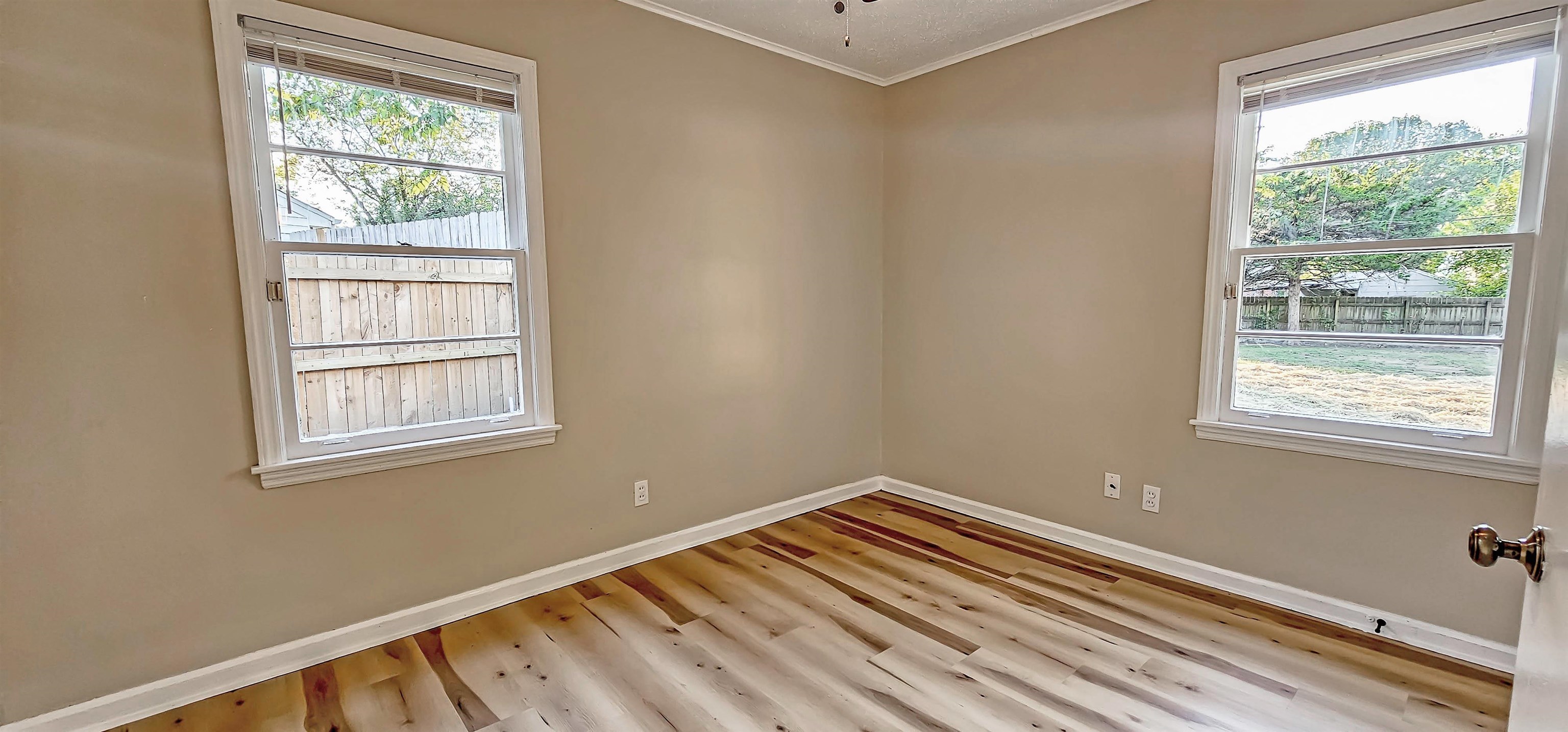 4420 Helene Road Memphis, TN 38117 - Photo 14 of 22 a view of a room with wooden floor and windows