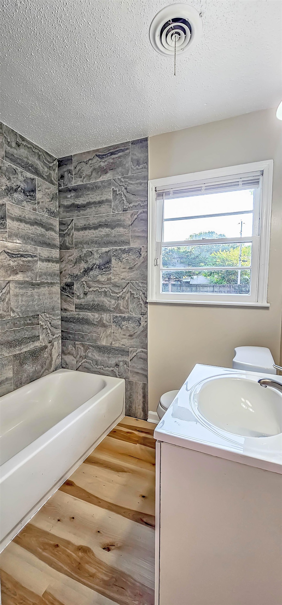 4420 Helene Road Memphis, TN 38117 - Photo 16 of 22 a bathroom with a sink and a bathtub