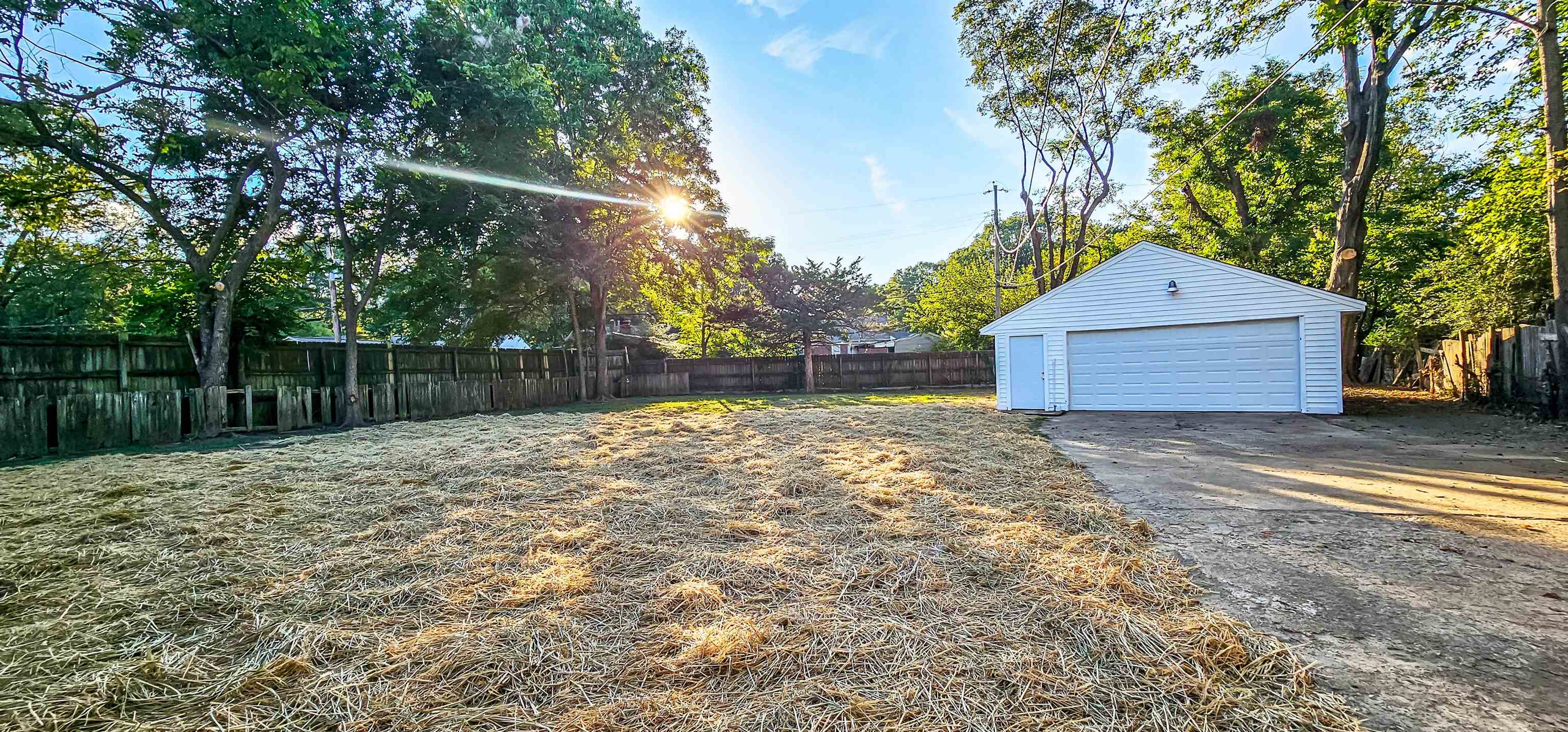 4420 Helene Road Memphis, TN 38117 - Photo 3 of 22 a front view of a house with a yard and garage