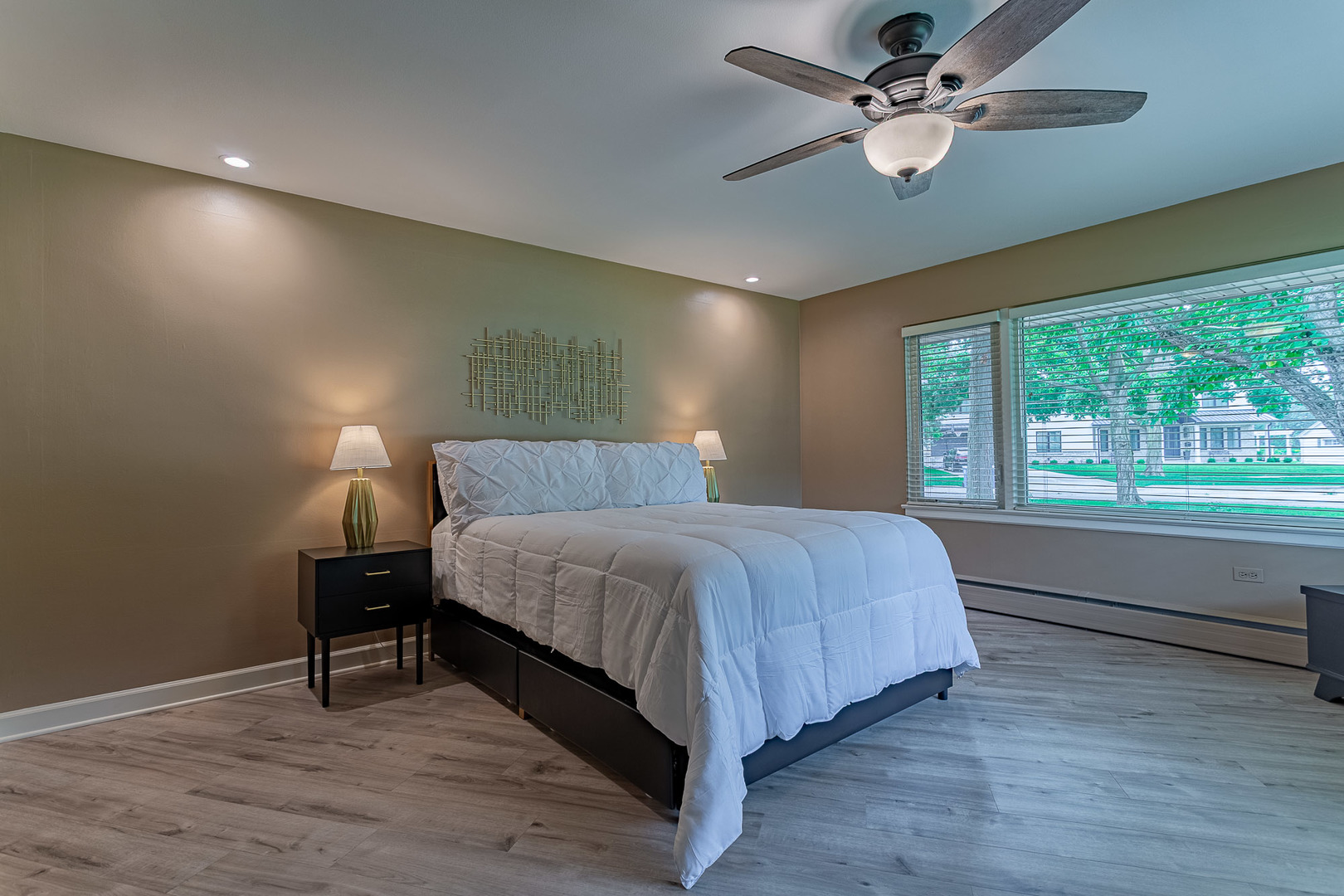 711 Greenview Road Itasca, IL 60143 - Photo 12 of 36 a bedroom with a bed and a chandelier