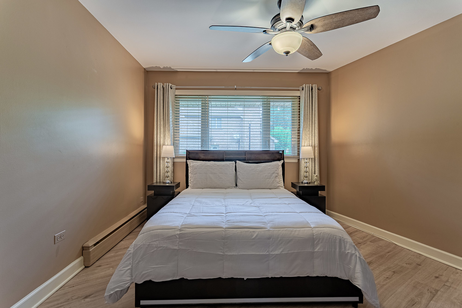 711 Greenview Road Itasca, IL 60143 - Photo 16 of 36 a bed sitting in a bedroom next to a window