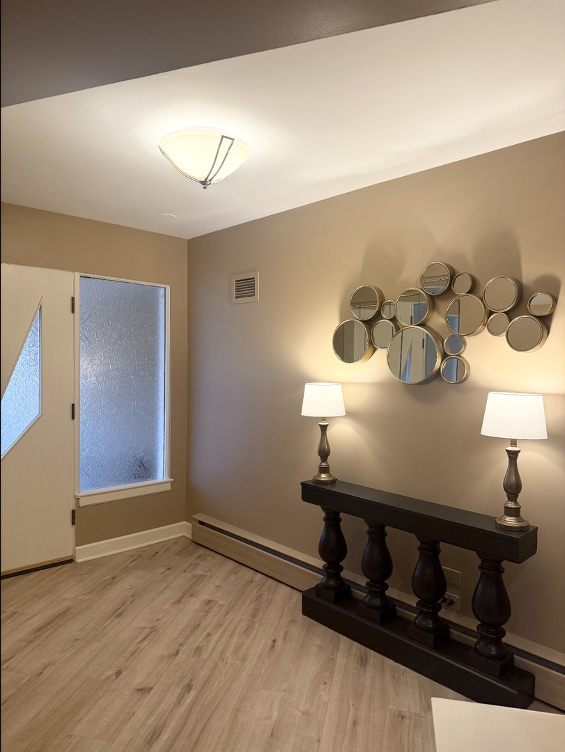 711 Greenview Road Itasca, IL 60143 - Photo 4 of 36 a room with furniture and wooden floor