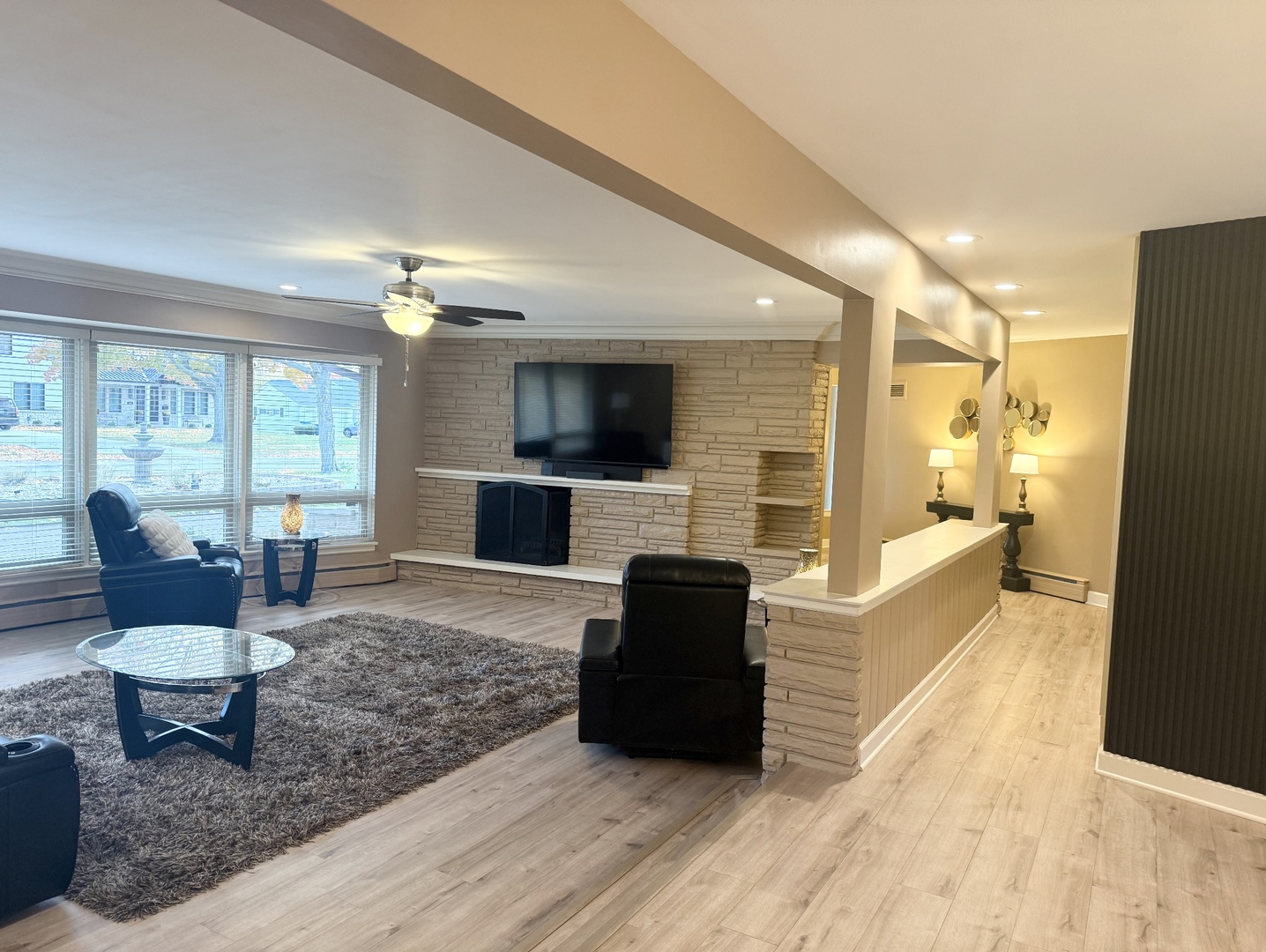 711 Greenview Road Itasca, IL 60143 - Photo 5 of 36 a living room with fireplace furniture and a flat screen tv