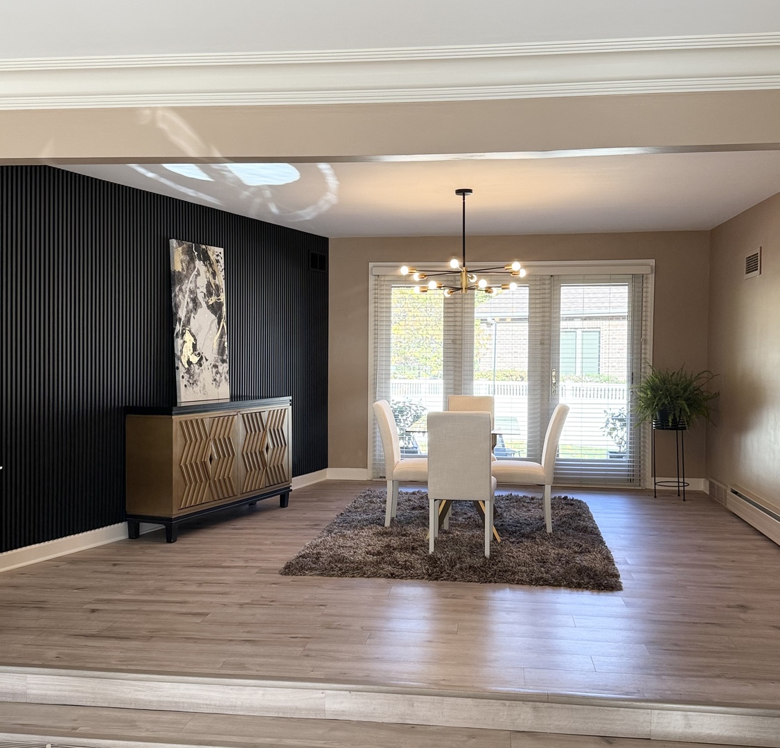 711 Greenview Road Itasca, IL 60143 - Photo 6 of 36 a view of a dining room with furniture window and wooden floor