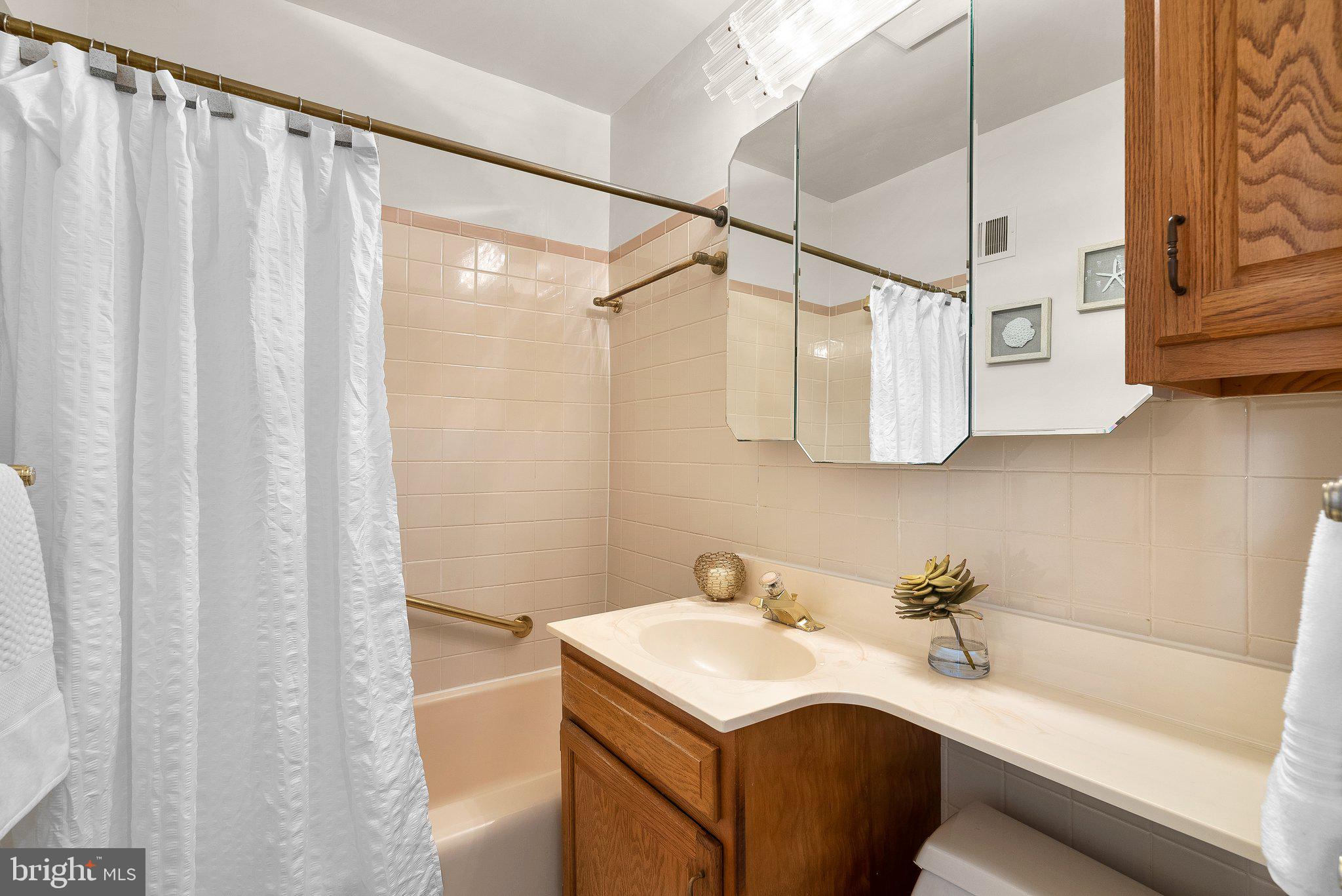 4945 Sargent Road Northeast Washington, DC 20017 - Photo 23 of 36 Upper Level
Hallway Bath