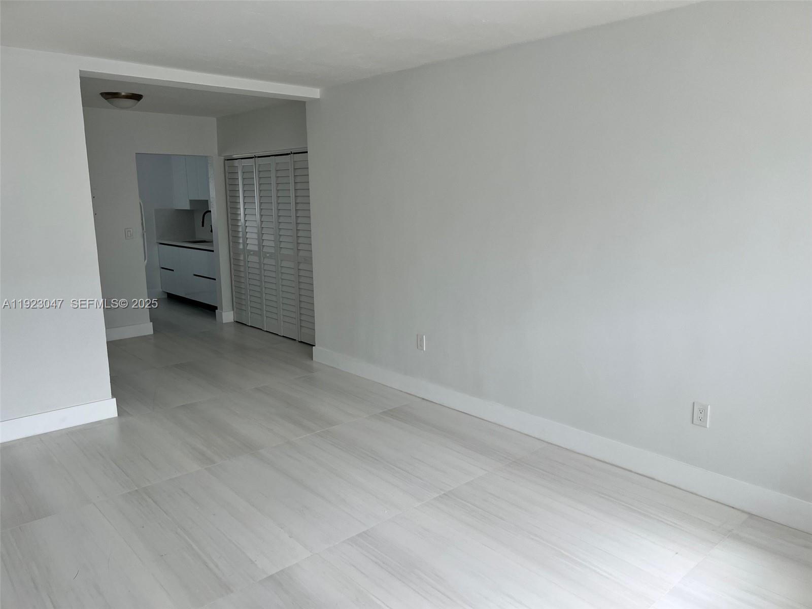 944 Meridian Avenue, Unit 10 Miami Beach, FL 33139 - Photo 13 of 15 a view of an empty room and fire place
