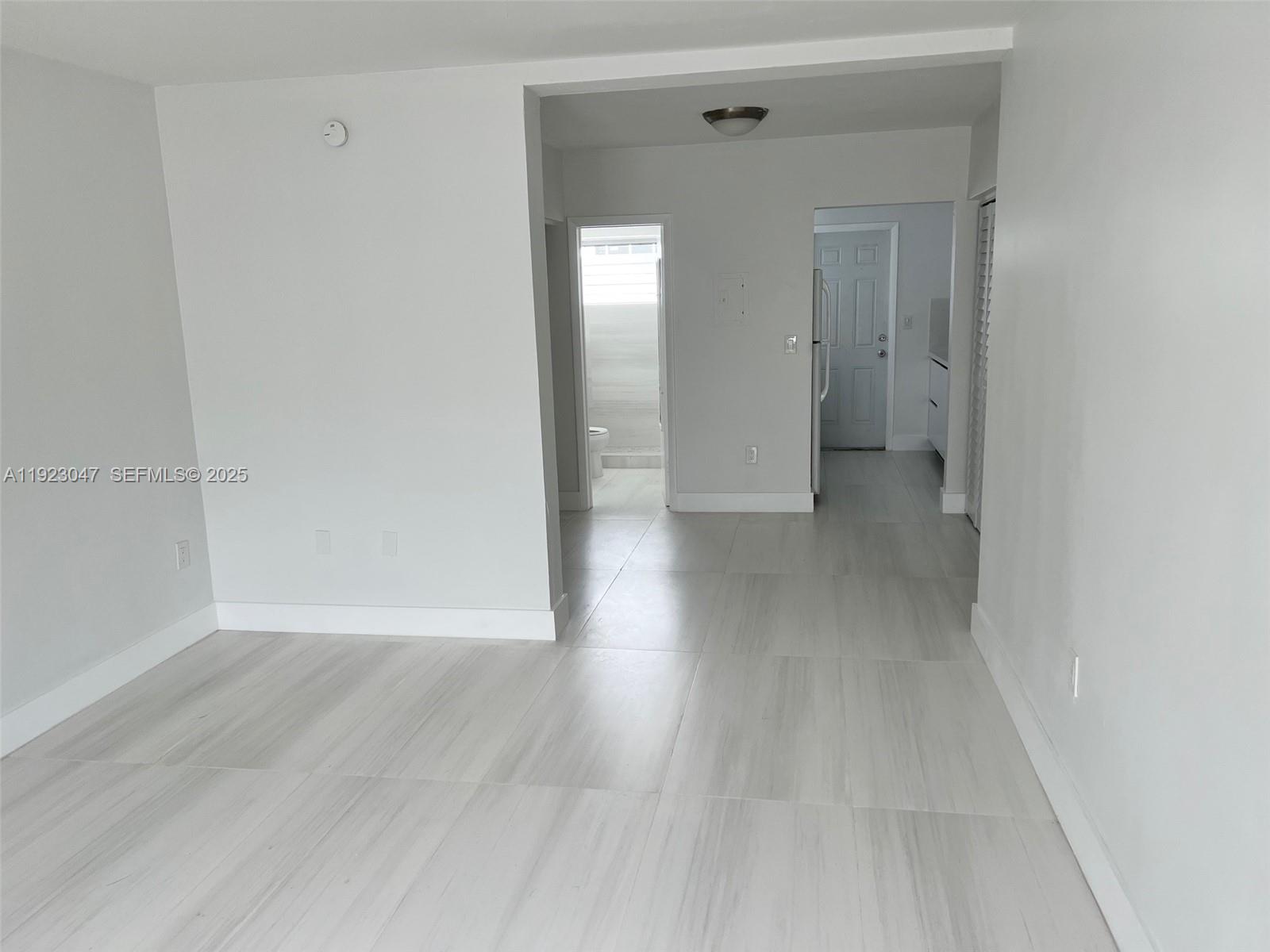 944 Meridian Avenue, Unit 10 Miami Beach, FL 33139 - Photo 14 of 15 a view of a hallway with wooden floor