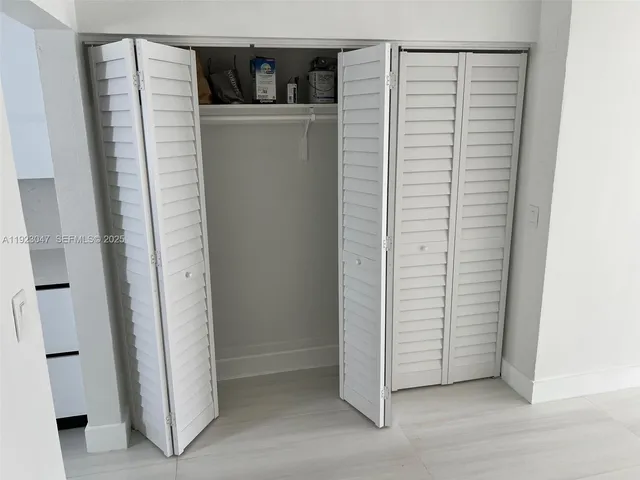 an entryway with a cabinet