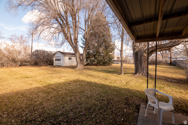 160 North 100 W Street Beaver, UT 84713 - Photo 6 of 36 View of green lawn featuring an outbuilding