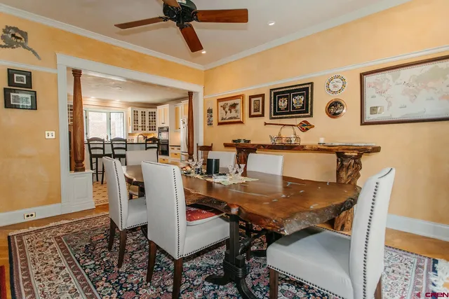 a dining room with furniture and window