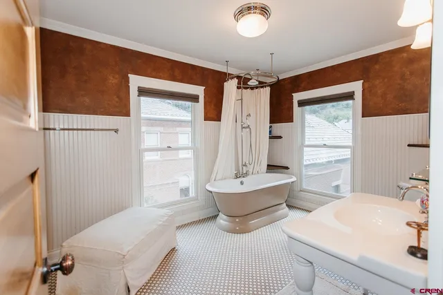 a spacious bathroom with a sink mirror and a shower