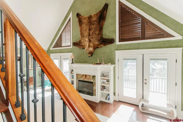 a view of a entryway with wooden floor and stairs