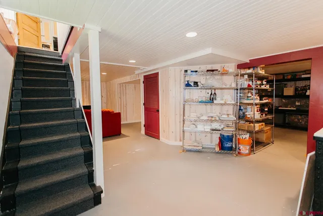 a bed room with a bed and a television