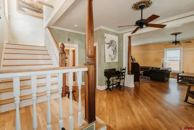a view of a livingroom with furniture and a flat screen tv