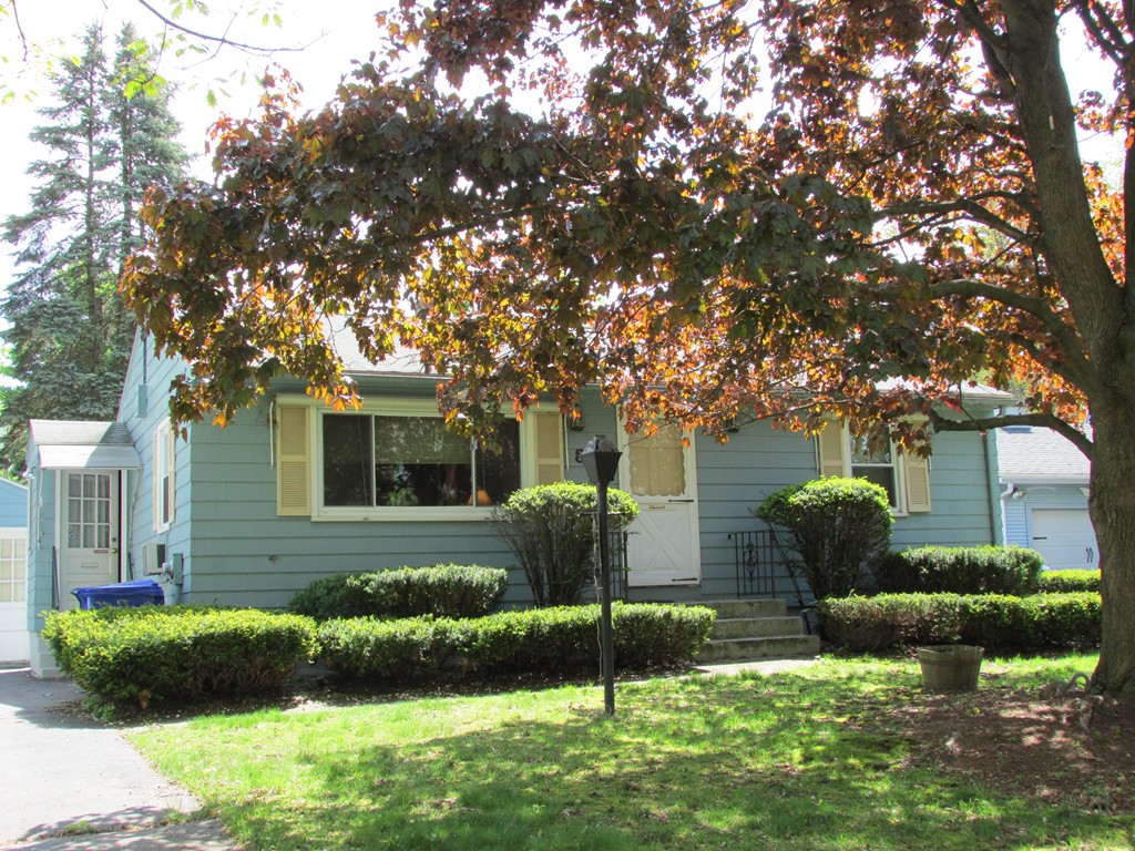 89 Clement Street Springfield, MA 01118 - Photo 1 of 14 a front view of a house with garden