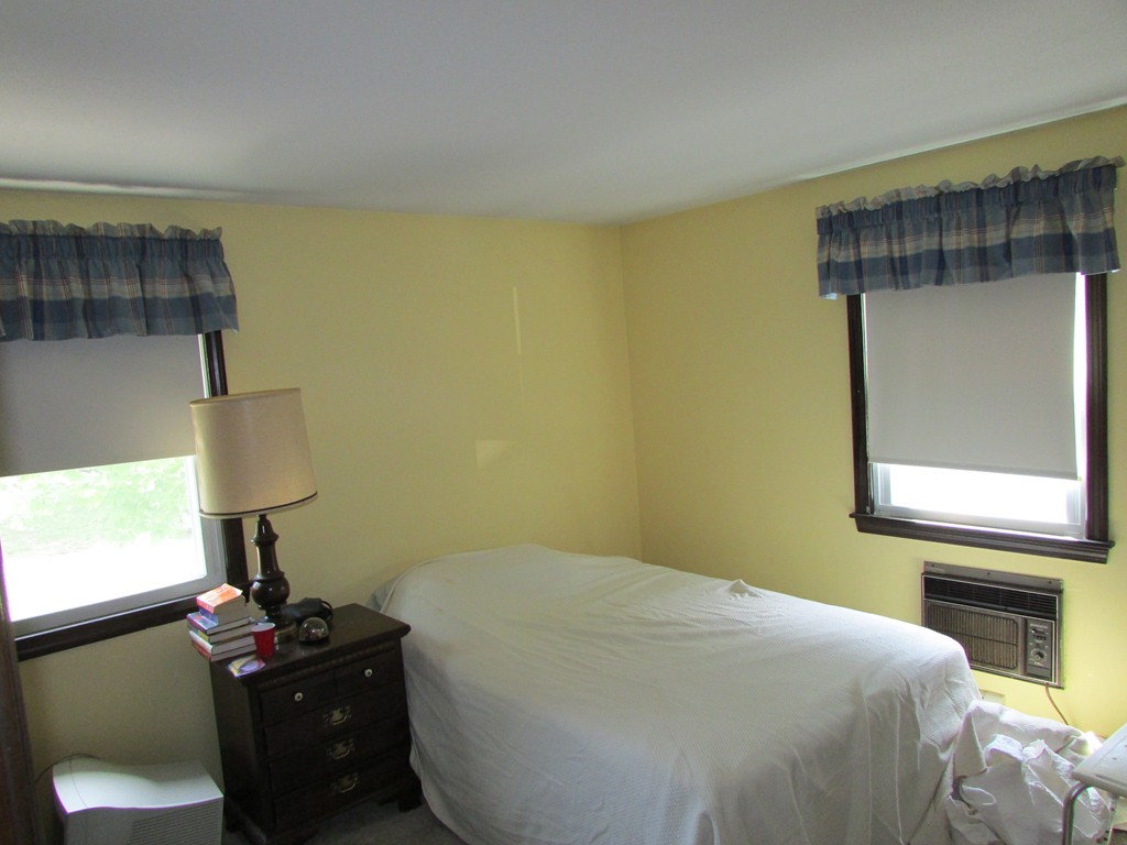 89 Clement Street Springfield, MA 01118 - Photo 12 of 14 a bedroom with a bed and a window