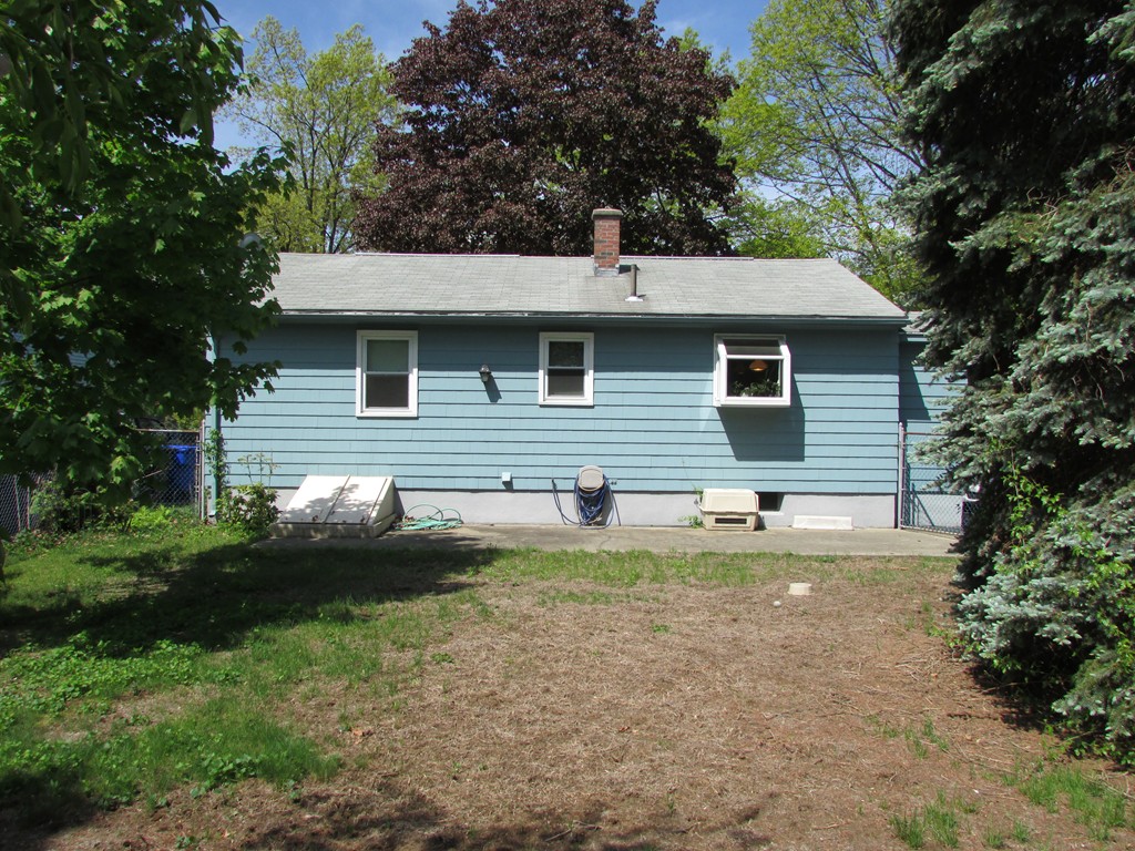 89 Clement Street Springfield, MA 01118 - Photo 3 of 14 a view of a house with a yard