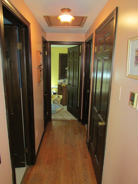 89 Clement Street Springfield, MA 01118 - Photo 9 of 14 a view of a hallway with wooden floor
