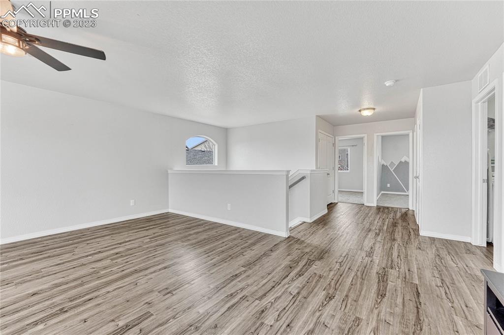 1064 Diamond Rim Drive Colorado Springs, CO 80921 - Photo 11 of 30 a view of empty room with wooden floor