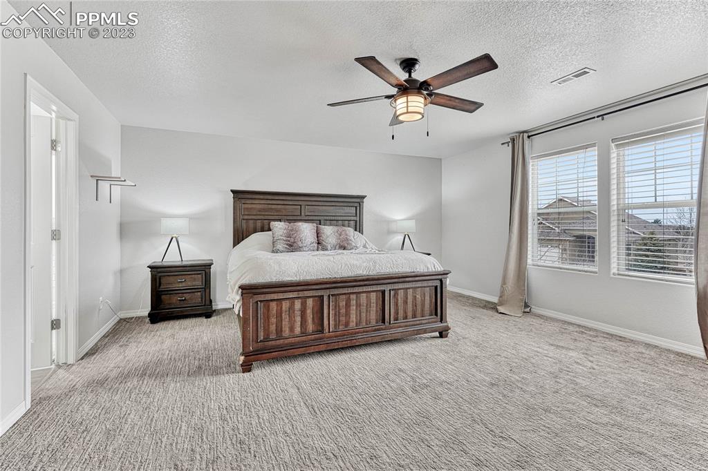 1064 Diamond Rim Drive Colorado Springs, CO 80921 - Photo 13 of 30 a bedroom with a bed and window