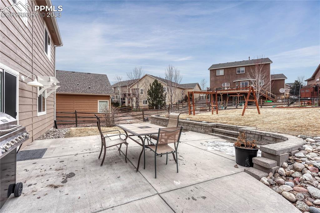 1064 Diamond Rim Drive Colorado Springs, CO 80921 - Photo 24 of 30 a building outdoor space with patio furniture and a potted plant