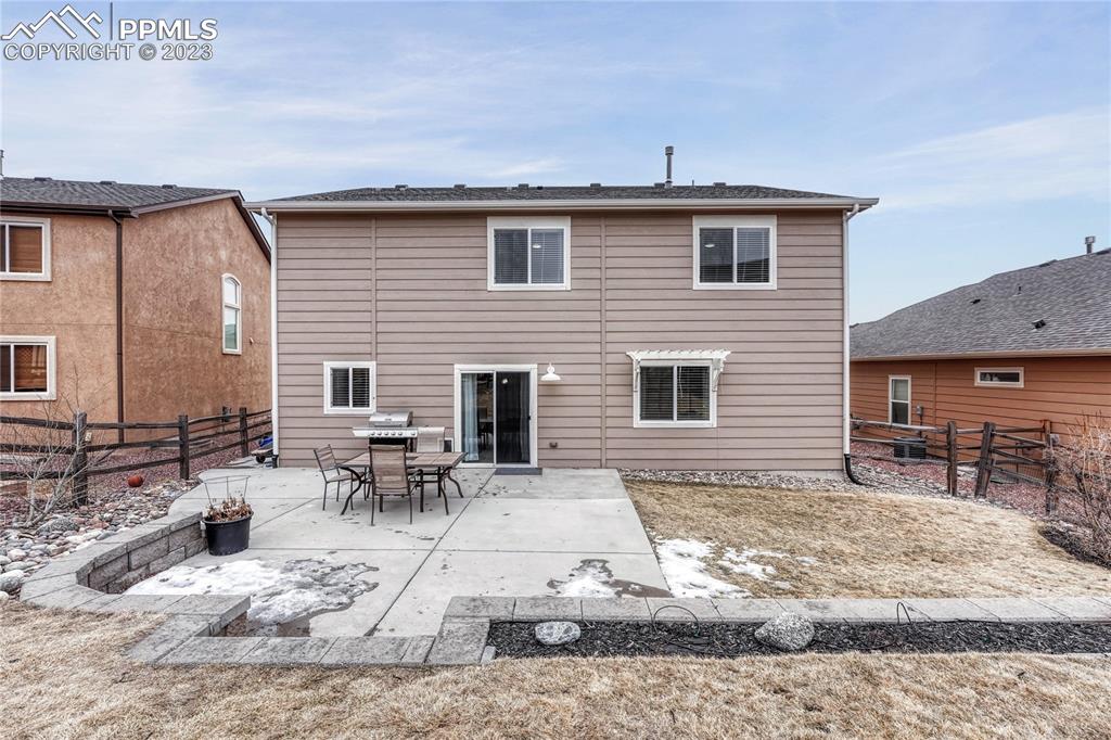 1064 Diamond Rim Drive Colorado Springs, CO 80921 - Photo 26 of 30 a view of a dinning table and chairs in the patio