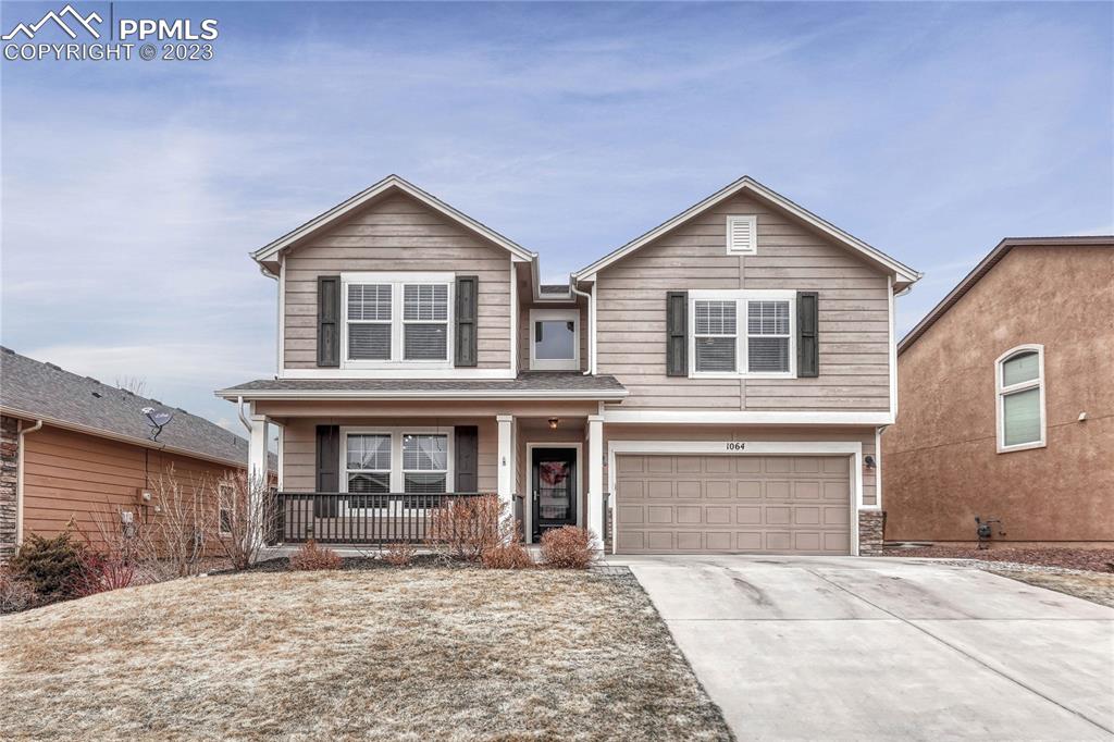 1064 Diamond Rim Drive Colorado Springs, CO 80921 - Photo 30 of 30 a front view of a house with yard