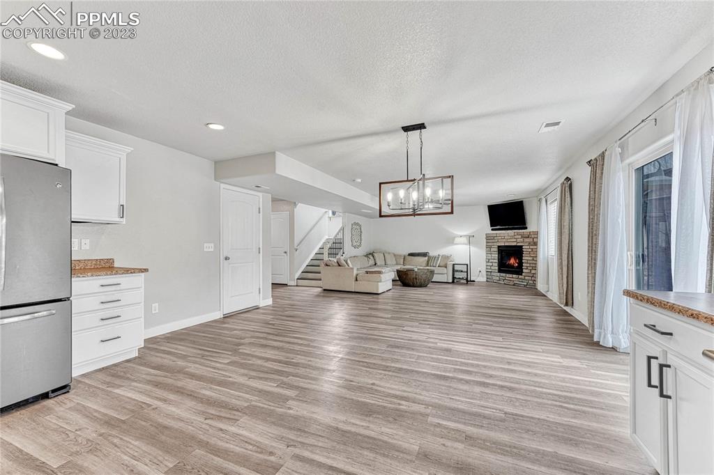 1064 Diamond Rim Drive Colorado Springs, CO 80921 - Photo 9 of 30 a view of a kitchen with sink microwave and refrigerator