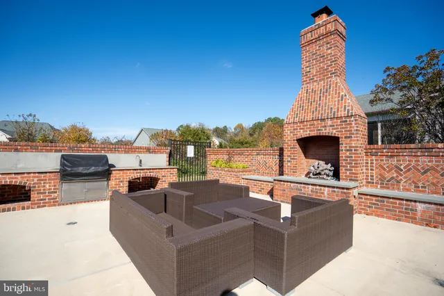 a view of a couches with a fire pit in the patio