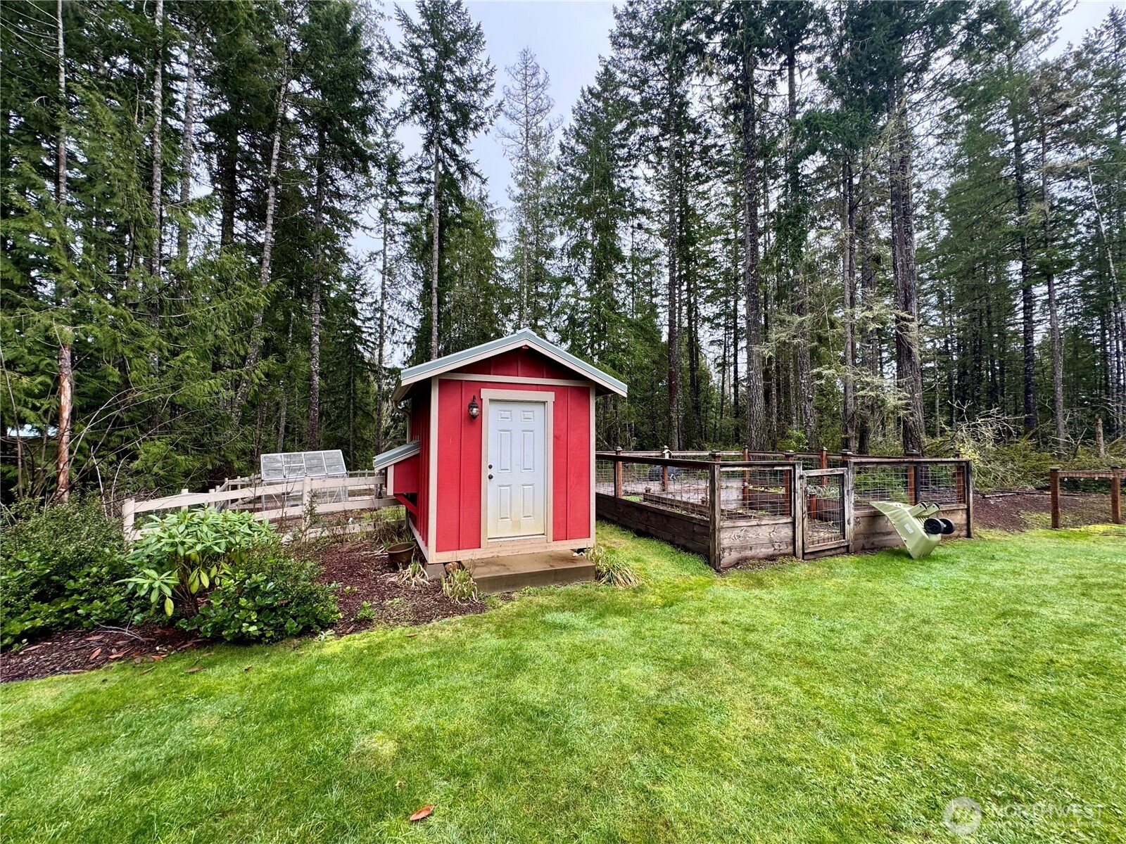 18349 Northwest Stavis Bay Road Seabeck, WA 98380 - Photo 11 of 40 a view of backyard with sitting area