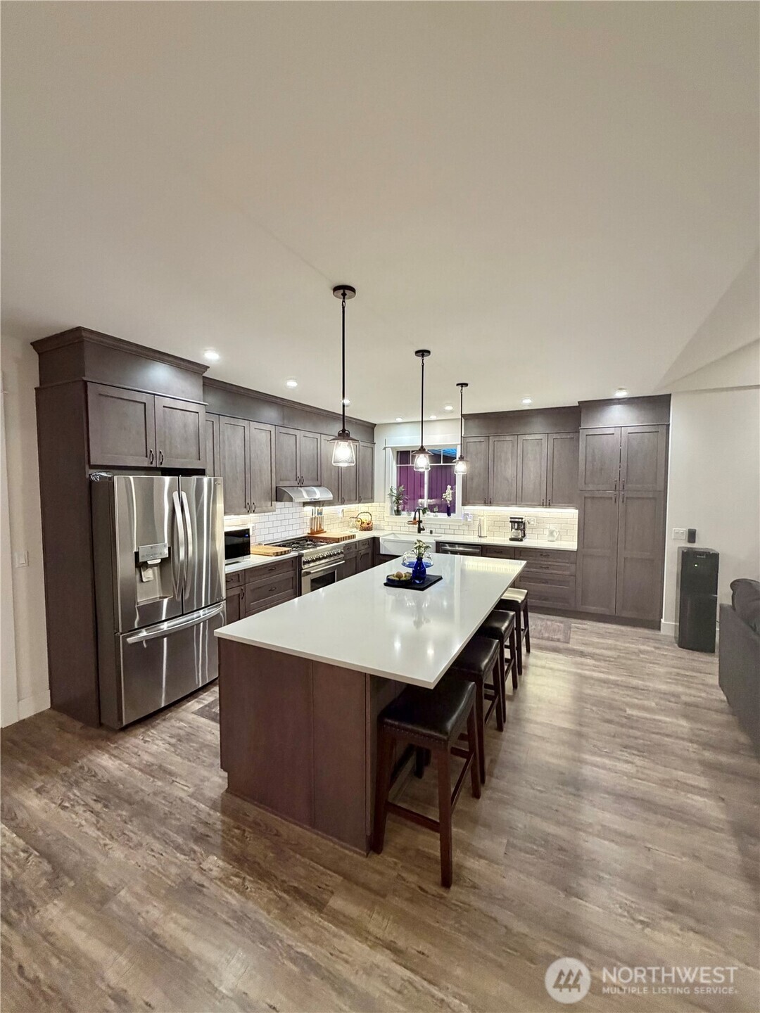 18349 Northwest Stavis Bay Road Seabeck, WA 98380 - Photo 14 of 40 a kitchen with stainless steel appliances granite countertop a sink a stove and refrigerator
