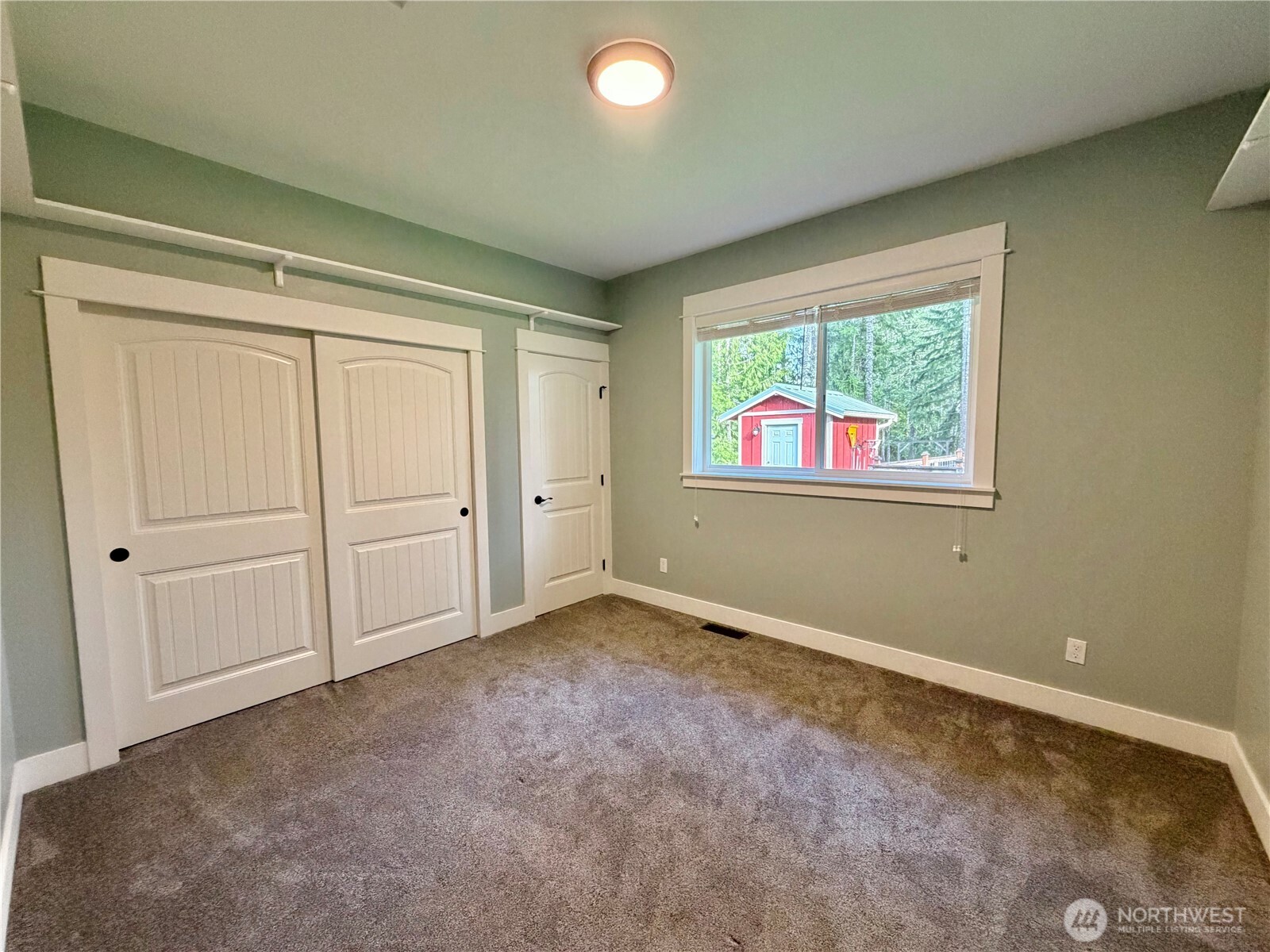 18349 Northwest Stavis Bay Road Seabeck, WA 98380 - Photo 25 of 40 an empty room with windows