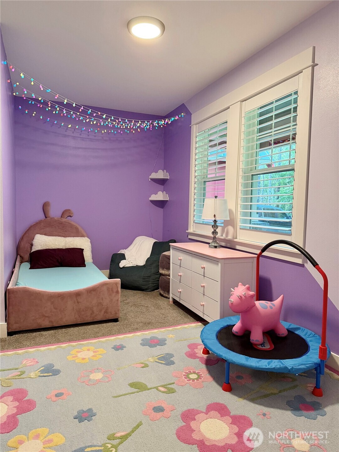 18349 Northwest Stavis Bay Road Seabeck, WA 98380 - Photo 28 of 40 a living room with furniture and a large window