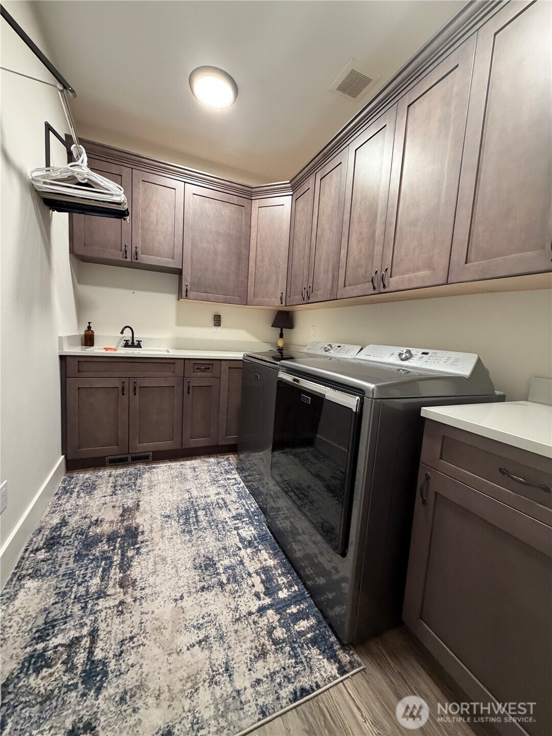 18349 Northwest Stavis Bay Road Seabeck, WA 98380 - Photo 30 of 40 a kitchen with a sink and cabinets